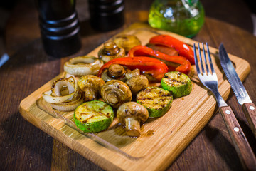 Fototapeta na wymiar Grilled vegetables, zucchini, red pepper, champignons, onions