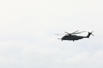 helicopter flying over the ocean