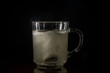 Man throws effervescent tablet into water