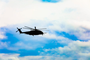 Fototapeta na wymiar helicopter flying over the ocean