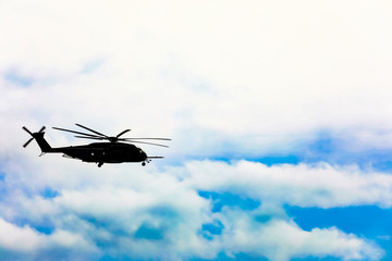 helicopter flying over the ocean