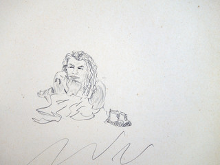 Portrait of a young man long curly hair lying on the sand by the sea, his shoes are standing next to him. Pencil drawing on rough paper