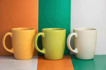 multi-colored ceramic cup on a colorful background
