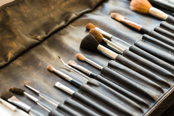 Fototapeta premium Leather case with professional makeup brushes