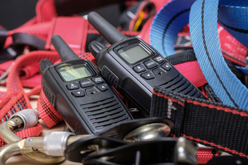walkie-talkies and equipment for industrial mountaineering, red ropes and connections