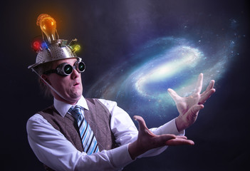 distraught looking conspiracy believer in suit with aluminum foil head holding the galaxy or...