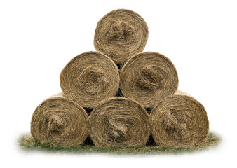 Stacked like a pyramid, bales of straw, tightened mesh . Feed and bedding for livestock on a dairy farm. Front view . Isolated photo .