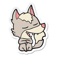 sticker of a cartoon wolf sitting laughing
