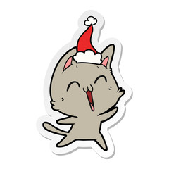 happy sticker cartoon of a cat wearing santa hat