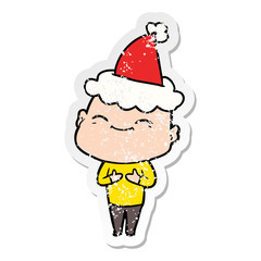 happy distressed sticker cartoon of a bald man wearing santa hat