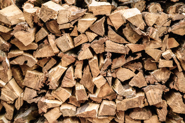 background of the wall of chopped firewoods