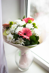 Bouguet of red and white flowers on the window. Birthday, wedding. celebration, summer and spring, floral concept