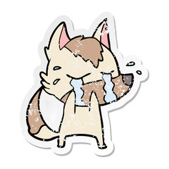 distressed sticker of a cartoon crying wolf