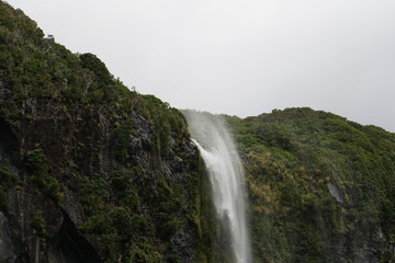 Fototapeta na wymiar Waterfall in Milford Sound