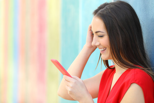 Fashion Happy Woman Checking Smart Phone Outside