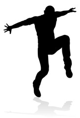 A male street dance hip hop dancer in silhouette