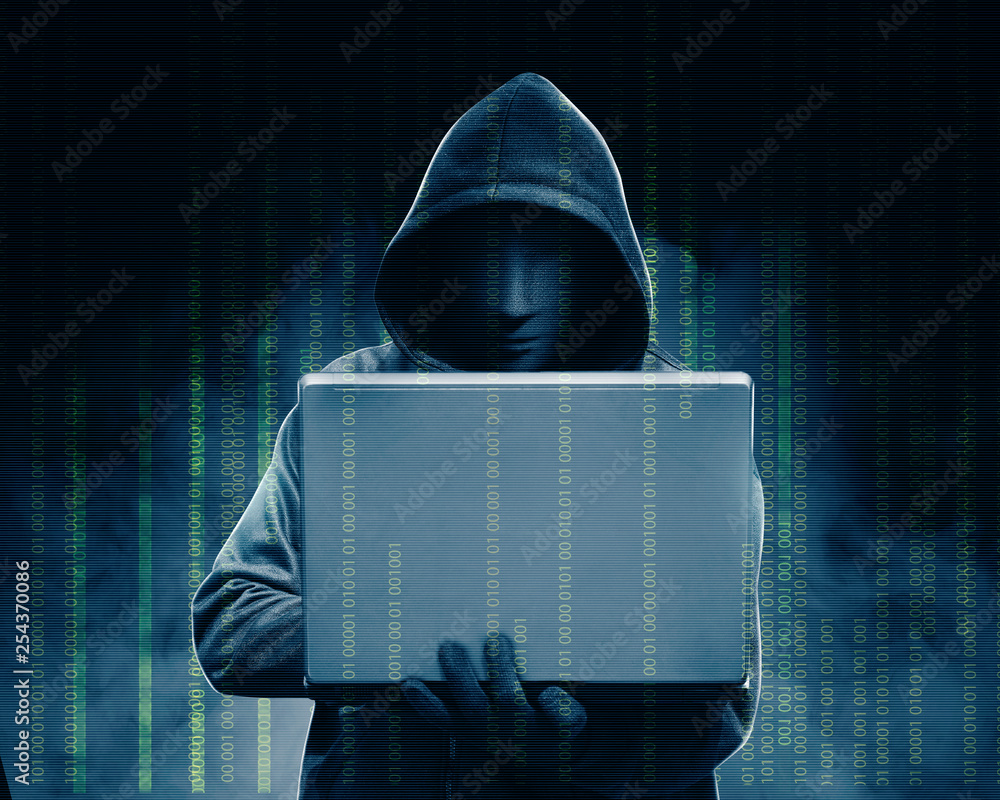 Aufkleber hacker in black hoodie holding laptop with his hand and binary code