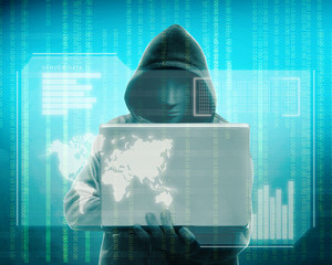 Hacker in black hoodie holding laptop with his hand and virtual screen display the server data, world maps, chart bar and binary code