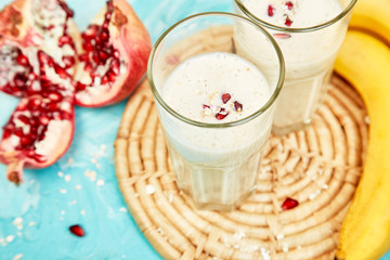 Smoothie with oat or oatmeal, banana and pomegranate