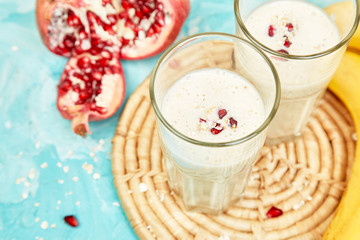 Smoothie with oat or oatmeal, banana and pomegranate