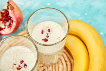 Smoothie with oat or oatmeal, banana and pomegranate