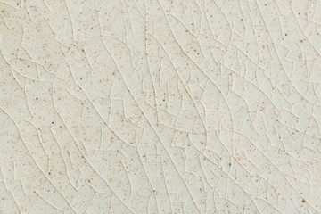 background and texture of stretch marks cracked on white cream glazed tile