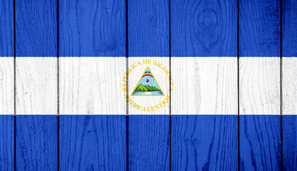 Flag of Nicaragua on wooden background