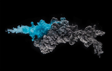 Coloured acrylic ink mixing in water on black
