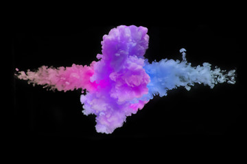 Coloured acrylic ink mixing in water on black