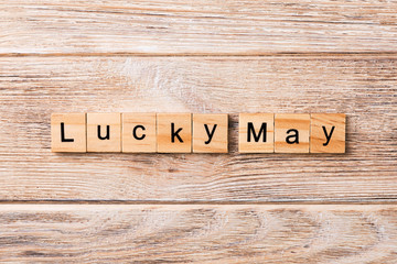 lucky May word written on wood block. lucky May text on table, concept