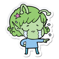 sticker of a cartoon crying alien girl