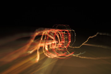 Blurred colourful car lights seen at night, different shapes