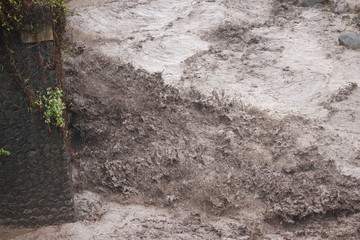 brown flood water from the summit of Mount Semeru , Bromo Tengger Semeru Park, Indonesia