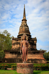 Obraz premium Pagoda and the buddha statue. in Old Buddhist temple in Sukhothai historical park In Thailand., Tourism, World Heritage Site, Civilization,UNESCO.
