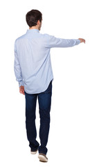 Back view of a man walking with a pointing hand.