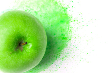 Green raw apple on hand drawn watercolor background of chartreuse color splashes paintbrush strokes. Creative food art poster. Mixed media image combination of photography illustration