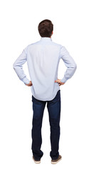 Back view of man in dark jeans. Standing young guy.