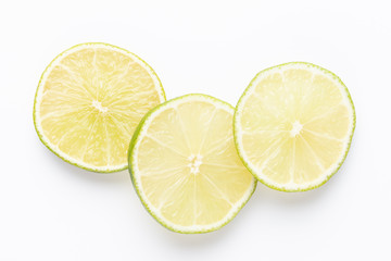 Composition with fresh ripe limes on light background, top view