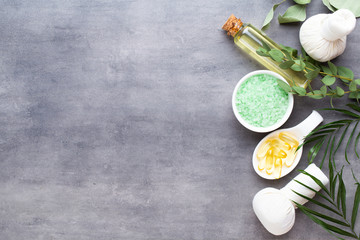 Spa treatment concept, flat lay composition with natural cosmetic products and massage brush, view from above, blank space for a text.