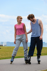 roller skater couple skating outdoor