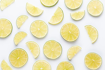 Lime fruit slices on white background.