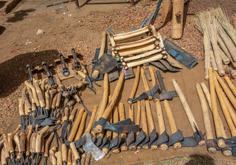 Hammer, sickle, hoe and other tools for field work in a market in Sudan