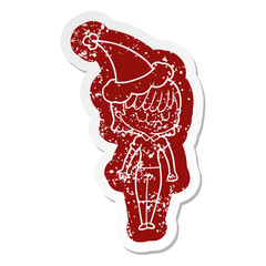 cartoon distressed sticker of a woman wearing santa hat