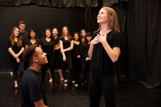 Male And Female Drama Students At Performing Arts School In Studio Improvisation Class
