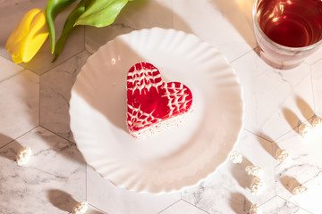 Heart shaped souffle cake on white saucer