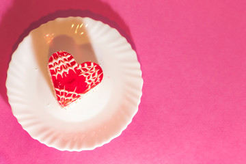 Heart shaped souffle cake on white saucer