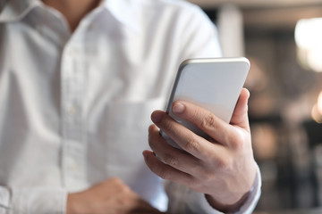 Business man hand hold smart phone. technology concept