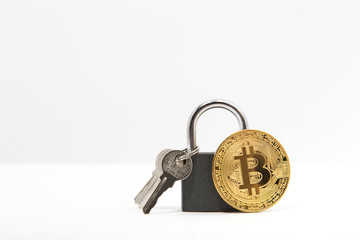 bitcoin with lock on white background