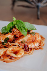 Spicy Italian Spaghetti Seafood Arrabbiata on white plate