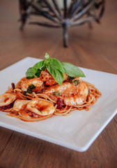 Spicy Italian Spaghetti Seafood Arrabbiata on white plate